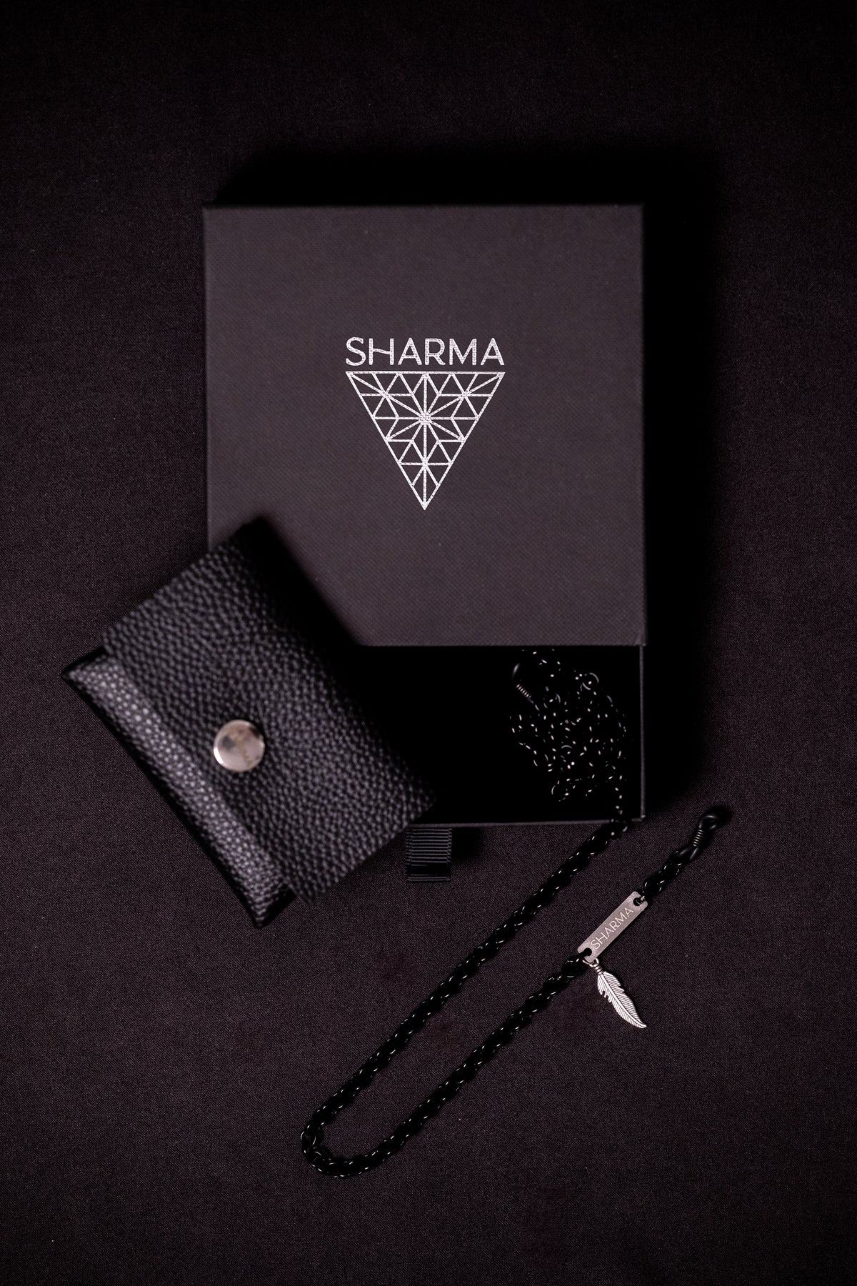 SHARMA Anita eyeglass chain — black, packaging