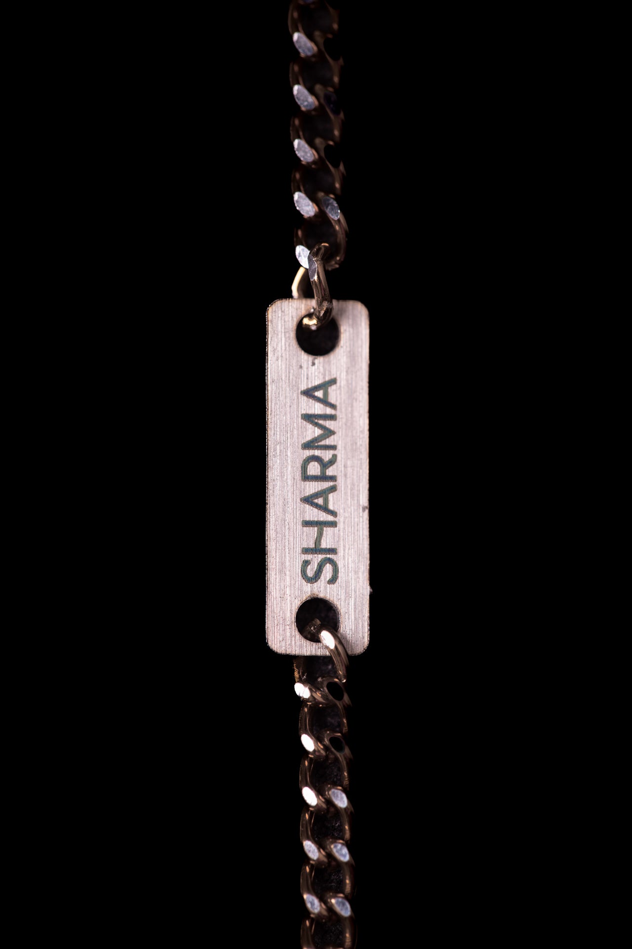 SHARMA Gaia face chain — bronze, macro detail